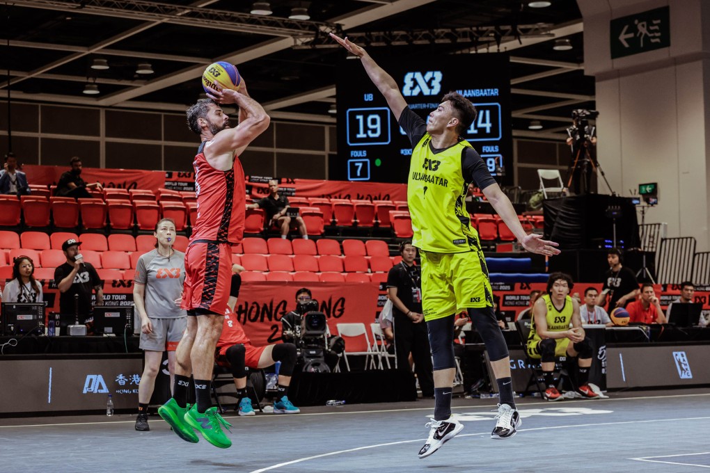 Ub’s Nemanja Barac (left) attempts a long-range shot against Ulaanbaatar MMC Energy in the quarter-final. Photo: Fiba
