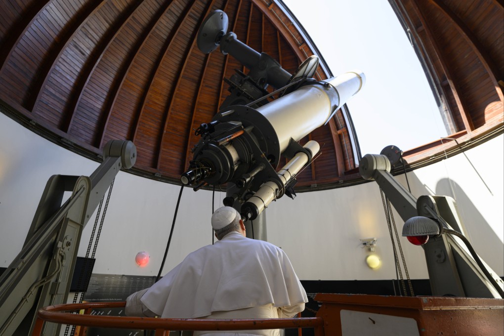 The pope looks through a large telescope at the Vatican astronomical observatory, one of the oldest astronomical research institutions in the world. Photo: IPA via ZUMA Press/dpa