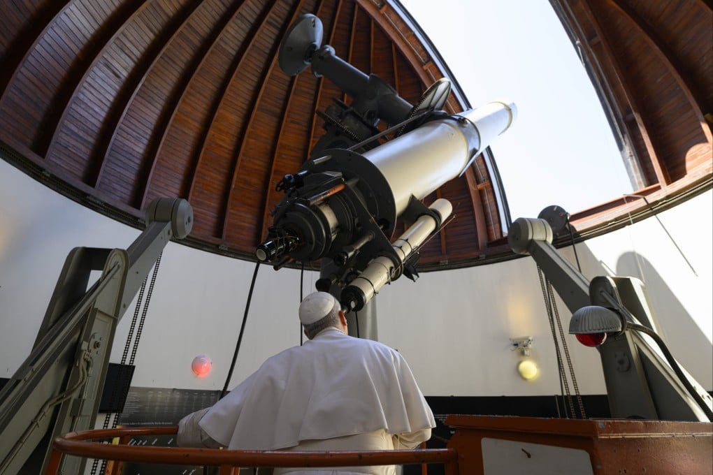 The pope looks through a large telescope at the Vatican astronomical observatory, one of the oldest astronomical research institutions in the world. Photo: IPA via ZUMA Press/dpa