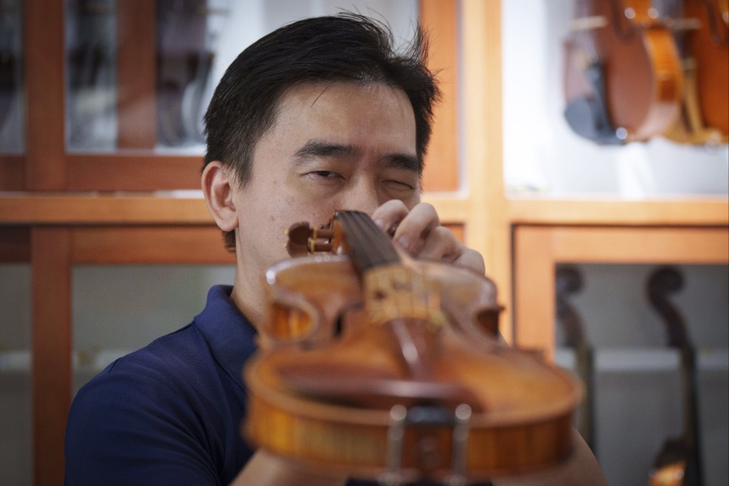 Malaysian luthier Tan Chin Sang checks a handcrafted violin at his workshop in the outskirts of Kuala Lumpur, Malaysia, on July 2, 2025. Photo: AP