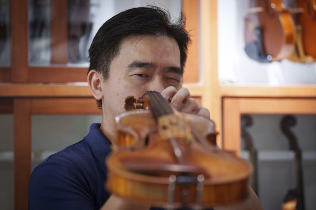 Malaysian luthier Tan Chin Sang checks a handcrafted violin at his workshop in the outskirts of Kuala Lumpur, Malaysia, on July 2, 2025. Photo: AP