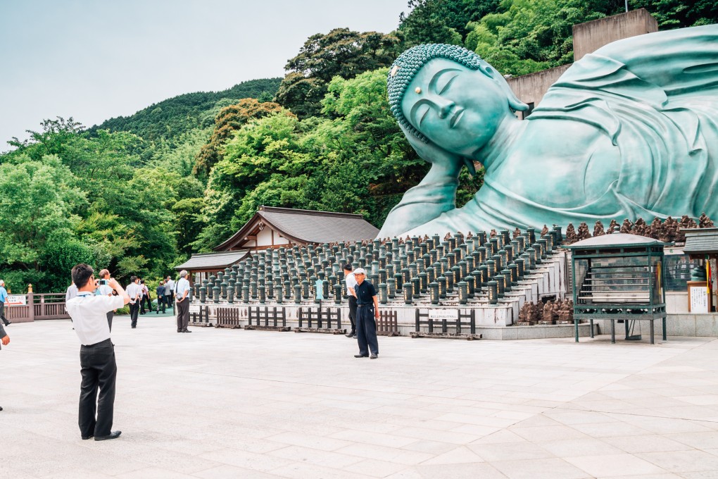 Nanzoin temple in Fukuoka prefecture, known for its 41-metre long reclining Buddha statue, has been charging foreign visitors since May. Photo: Shutterstock
