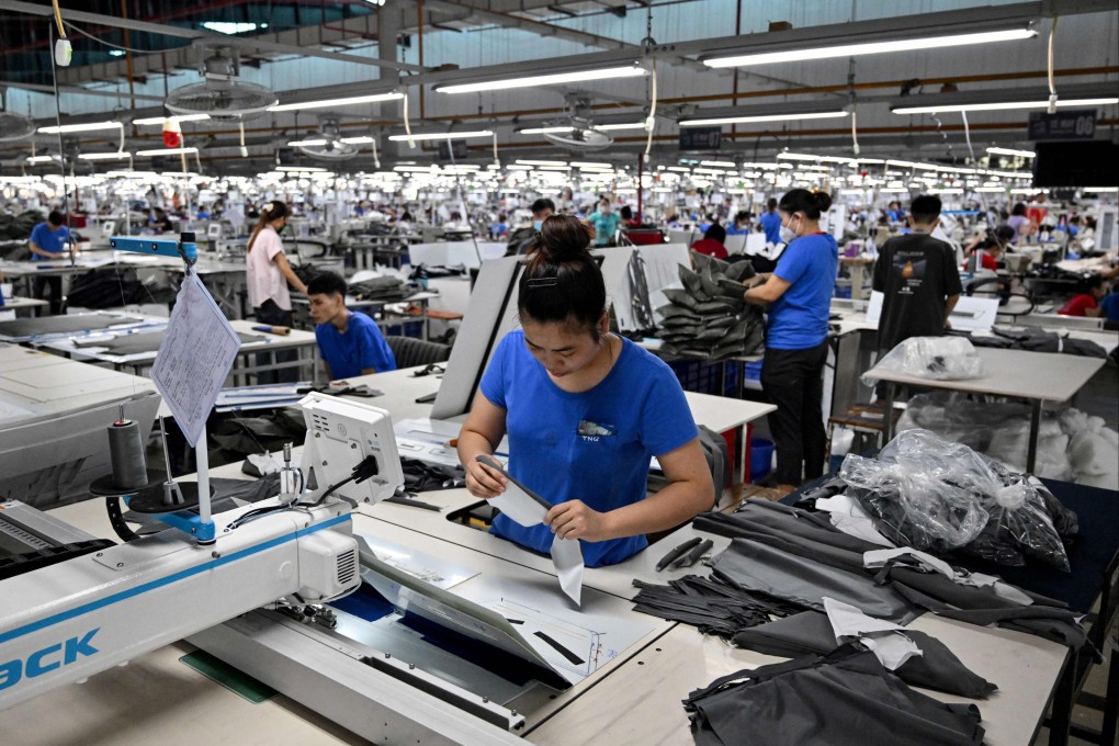 Workers stitch apparels at a garment factory in Vietnam’s Thai Nguyen province on July 2. Vietnam is one of the big winners from trade diversion and one of Asia’s best-performing industrial property markets amid the surge in demand for modern factories and warehouses. Photo: AFP