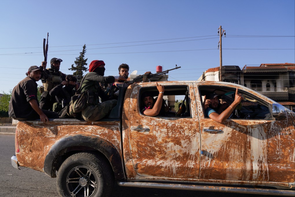 Bedouin fighters ride a truck in the village of Al-Mazraa, after days of violence in the Sweida. Photo: Reuters