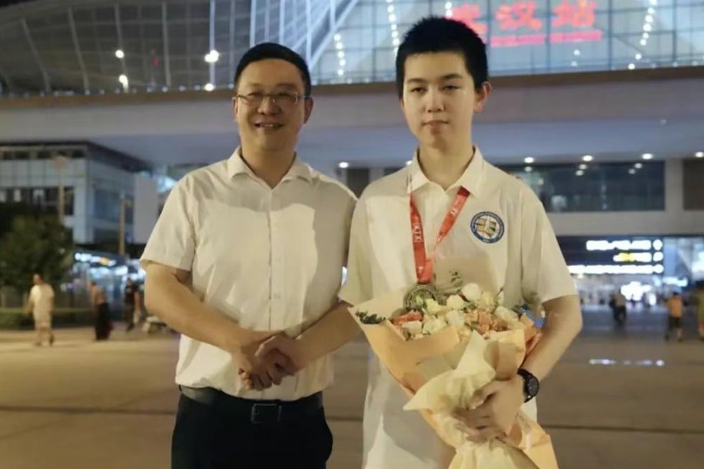 High school student Xu Qiming (right) overcame the limits of cerebral palsy to help Team China reclaim the crown at this year’s International Mathematical Olympiad held in Australia. Photo: Handout