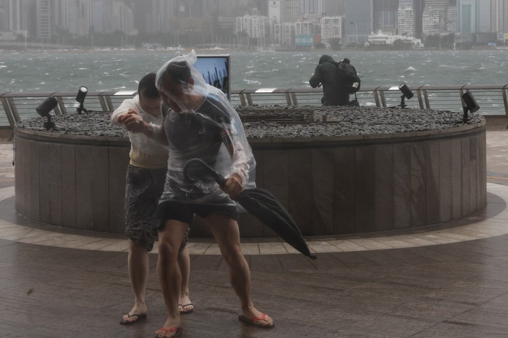 People brace against the wind at the Tsim Sha Tsui waterfront as the Hong Kong Observatory issued the No 10 typhoon warning for Typhoon Wipha. Photo: Edmond So