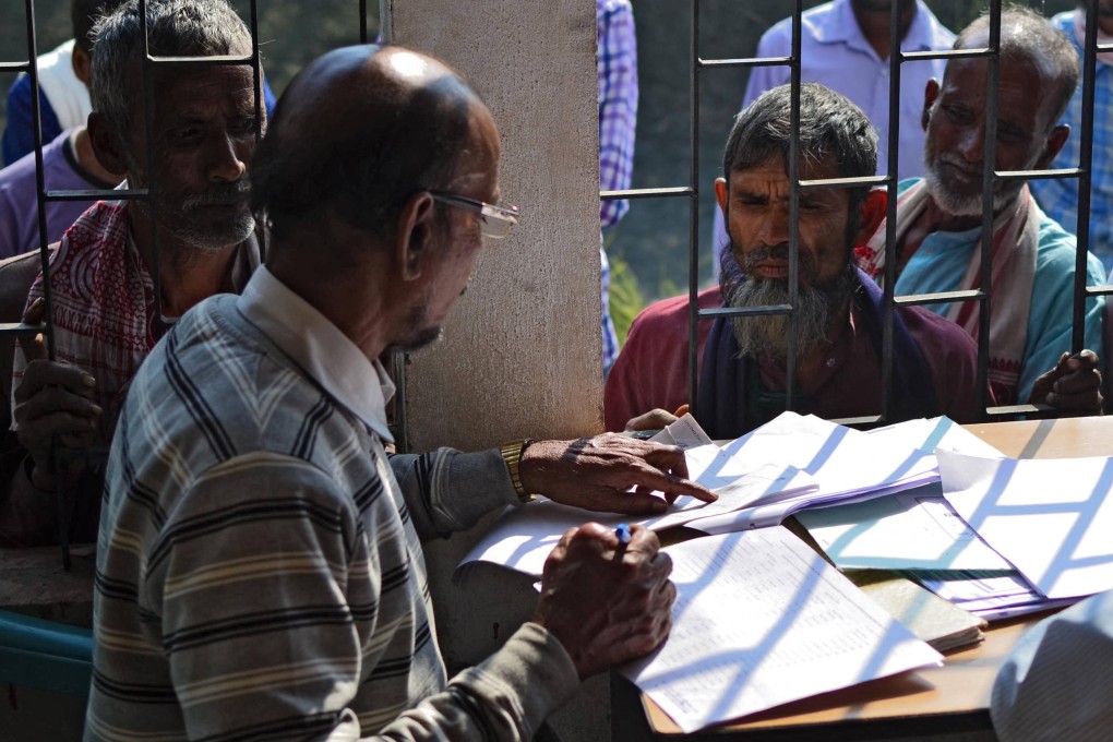 People wait to check their names on the National Register of Citizens in India’s Assam state. Indian election officials have given voters in the state of Bihar just weeks to prove their citizenship. Photo: AFP