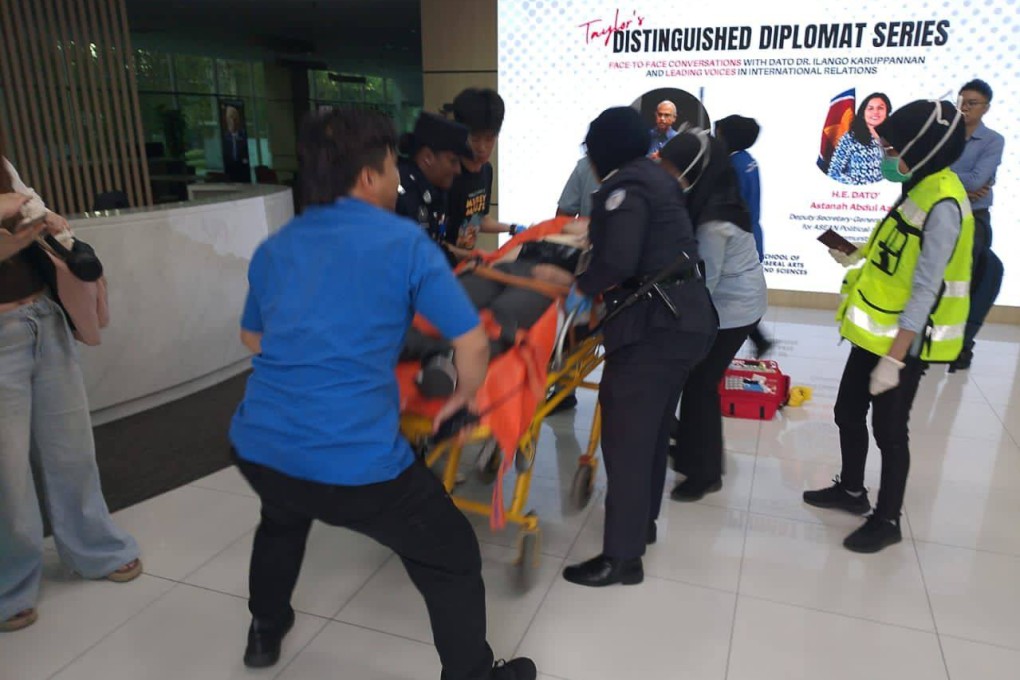 A photo released by Malaysian police shows the victim of a knife attack being rushed to hospital for treatment on July 14. Photo: Handout