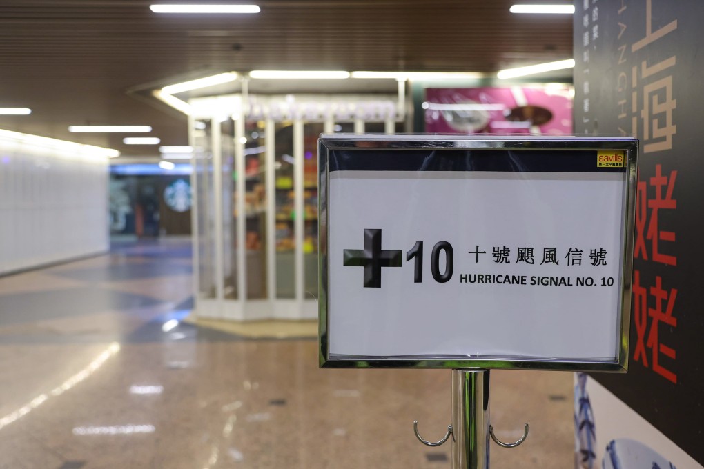A sign at an empty shopping centre in Tsim Sha Tsui on Sunday warns a T10 signal is in effect on Sunday. Photo: Edmond So
