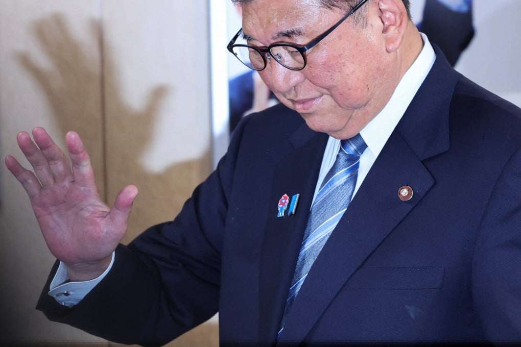 Japan’s Prime Minister Shigeru Ishiba reacts after meeting with LDP officials at the party’s headquarters in Tokyo on Wednesday. Photo: Reuters
