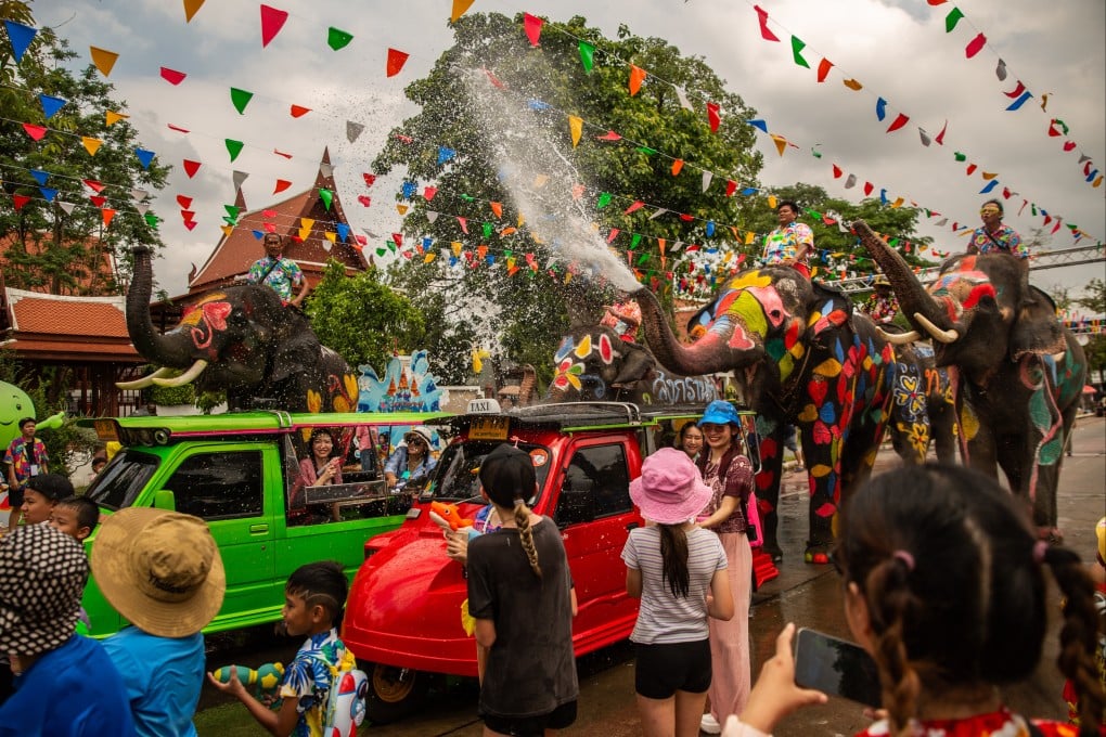 Locals and tourists in Phra Nakhon si Ayutthaya, Thailand, celebrate Songkran, the country’s new year festival, as elephants spray water on partygoers on April 13. Photo: Getty Images