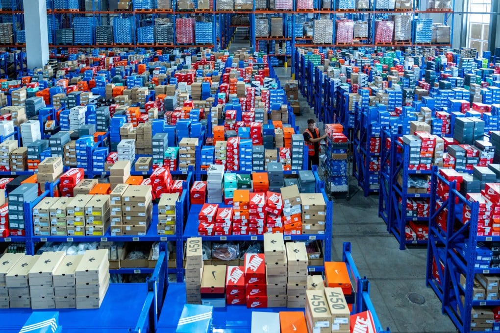 An employee transports express parcels at a logistics warehouse in Jinhua, Zhejiang province of China. Photo: Getty Images