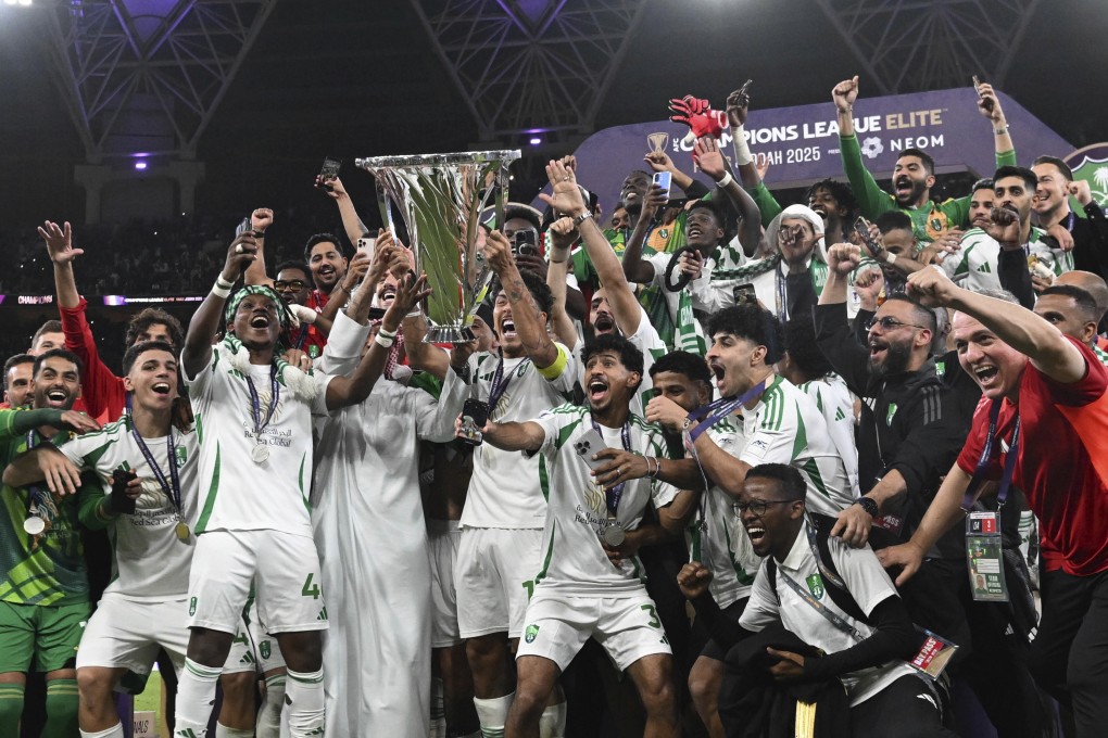 Al-Ahli’s Roberto Firmino holds the AFC Champions League Elite trophy after his side’s triumph in May. Photo: AP