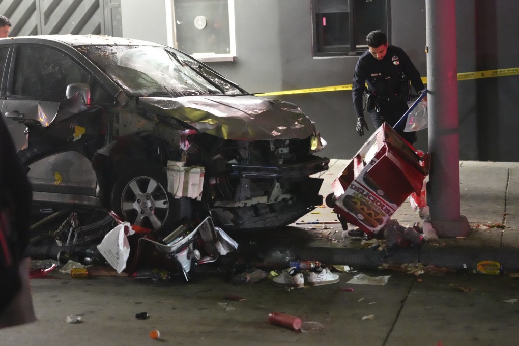 A vehicle sits on the pavement after ramming into a crowd of people waiting to enter a nightclub along a busy boulevard in Los Angeles on July 19. Photo: AP