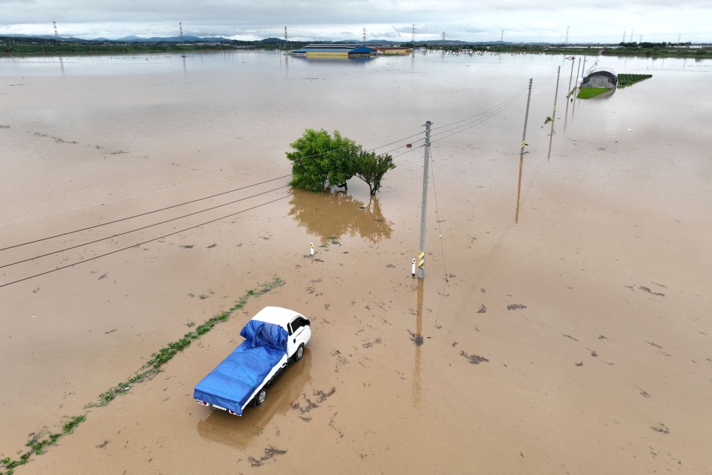 A flooded road caused by torrential rain in Yesan, South Korea. Photo: Yonhap via Reuters