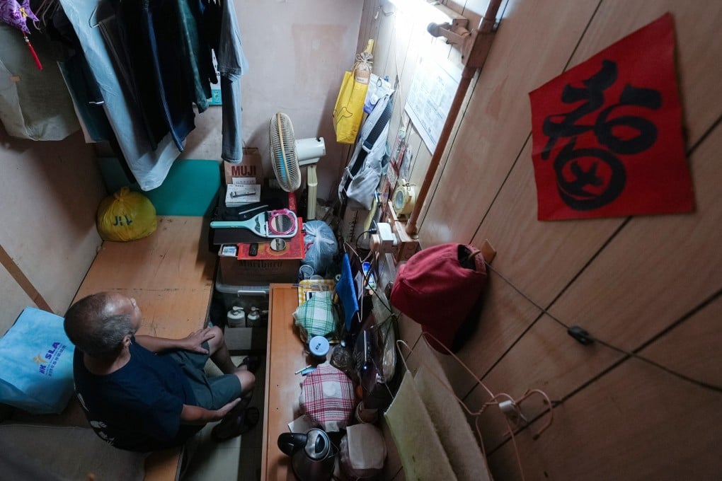 Choy, 66, a semi-retired construction worker, has lived in a 40 sq ft subdivided flat in Sham Shui Po for over 6 years and pays HK$2,400 in rent per month. Photo: Eugene Lee