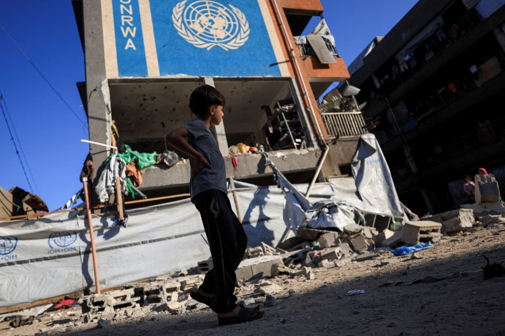 A Palestinian boy walks near an United Nations Relief and Works Agency for Palestine Refugees in the Near East (UNRWA) school sheltering displaced people that was hit in an overnight Israeli strike, in Gaza City on July 5. Photo: Reuters