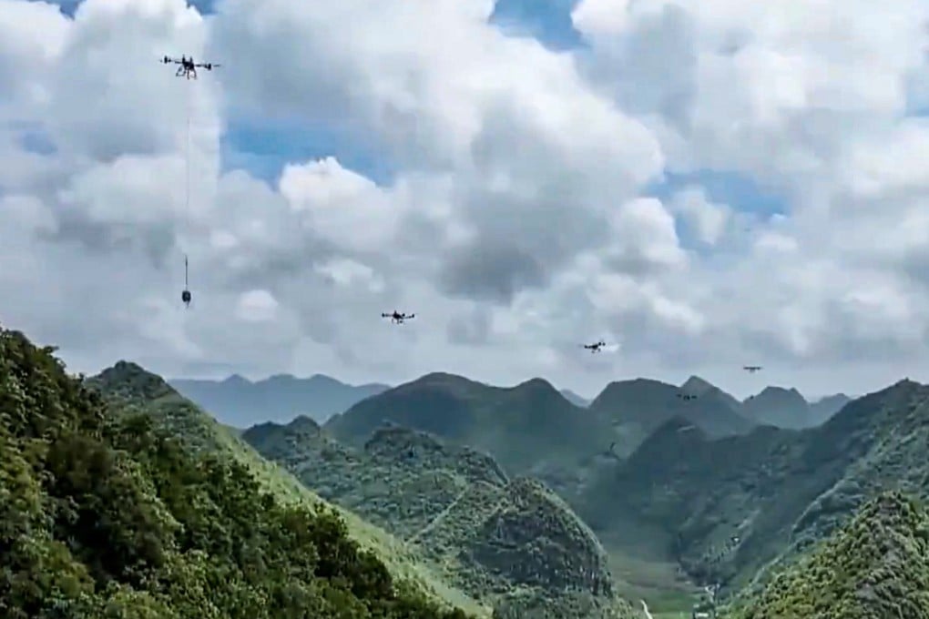 Heavy-lift drones, seen here in footage from state broadcaster CCTV, transport materials to build electricity transmission towers in a mountainous area of Yunnan province in southwest China. Photo: CCTV