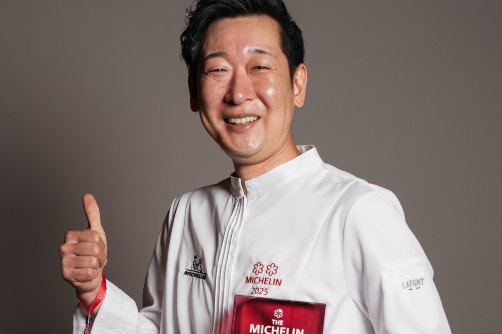 Chef-owner Yoshio Sakuta of Sushi Sakuta gives the thumbs up after his restaurant received its second Michelin star in the Michelin Guide Singapore 2025. Photo: Michelin Guide Singapore