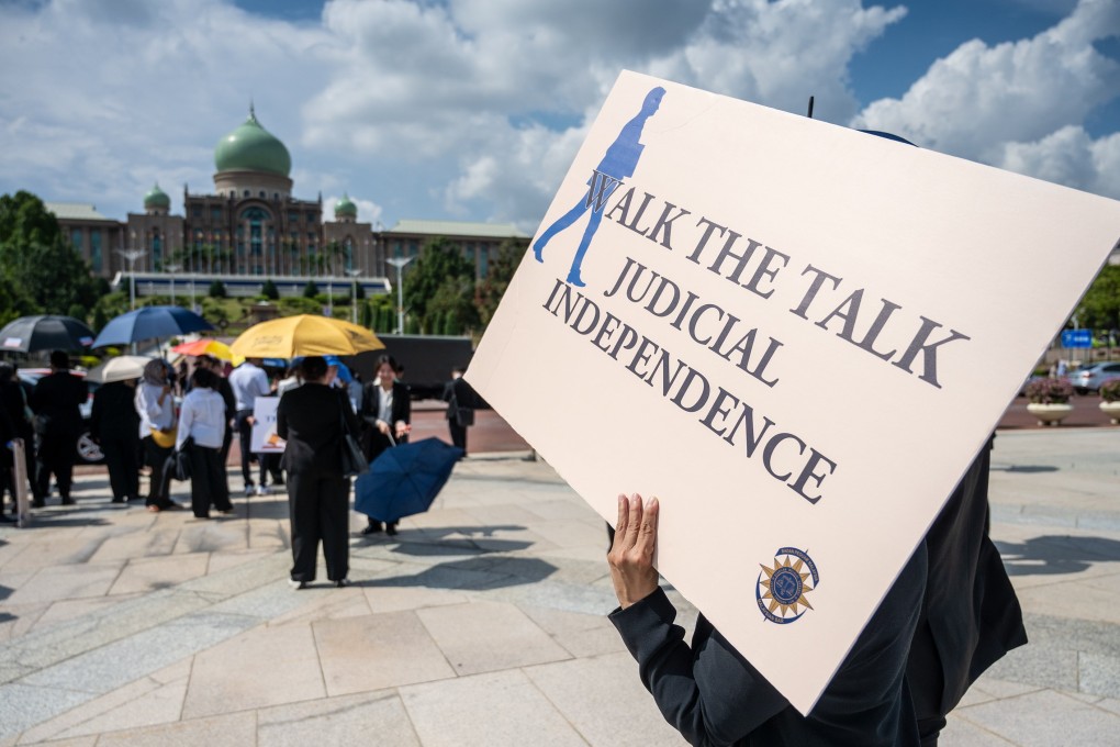 Lawyers and trainee lawyers gather in Putrajaya on July 14 for a “Walk to Safeguard Judicial Independence”. Photo: EPA