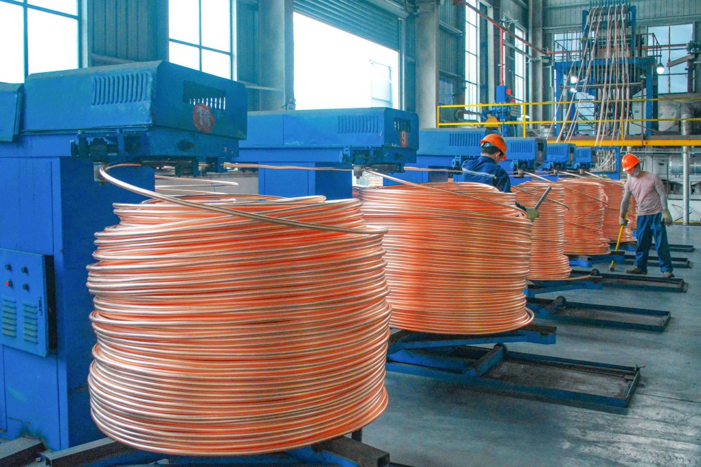 Copper rods are wound at a copper recycling plant in eastern China’s Anhui province. China continues to source large amounts of scrap metal from the US. Photo: AFP