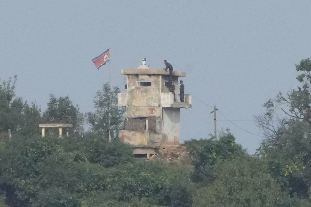 North Korean soldiers work at a military guard post as seen from Paju, South Korea, last year. Photo: AP
