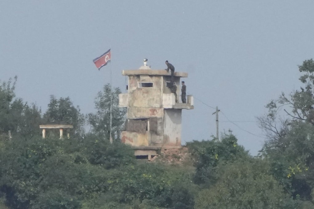 North Korean soldiers work at a military guard post as seen from Paju, South Korea, last year. Photo: AP
