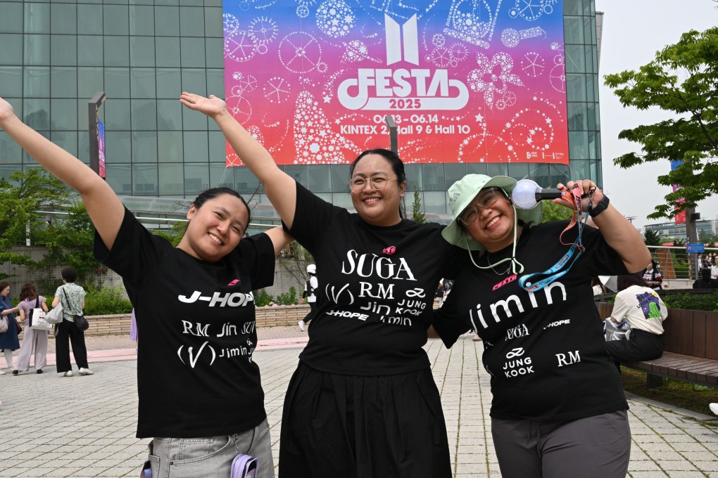 Fans of K-pop group BTS pose for photos as they attend the annual “BTS Festa” in Goyang on June 13. Photo: AFP