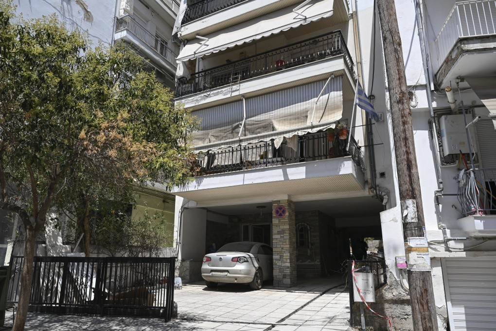 A view of the building where a bomb exploded, at the entrance of the home of president of the Greek association of prison guards, at a suburb of Thessaloniki in northern Greece on Saturday. Photo: AP