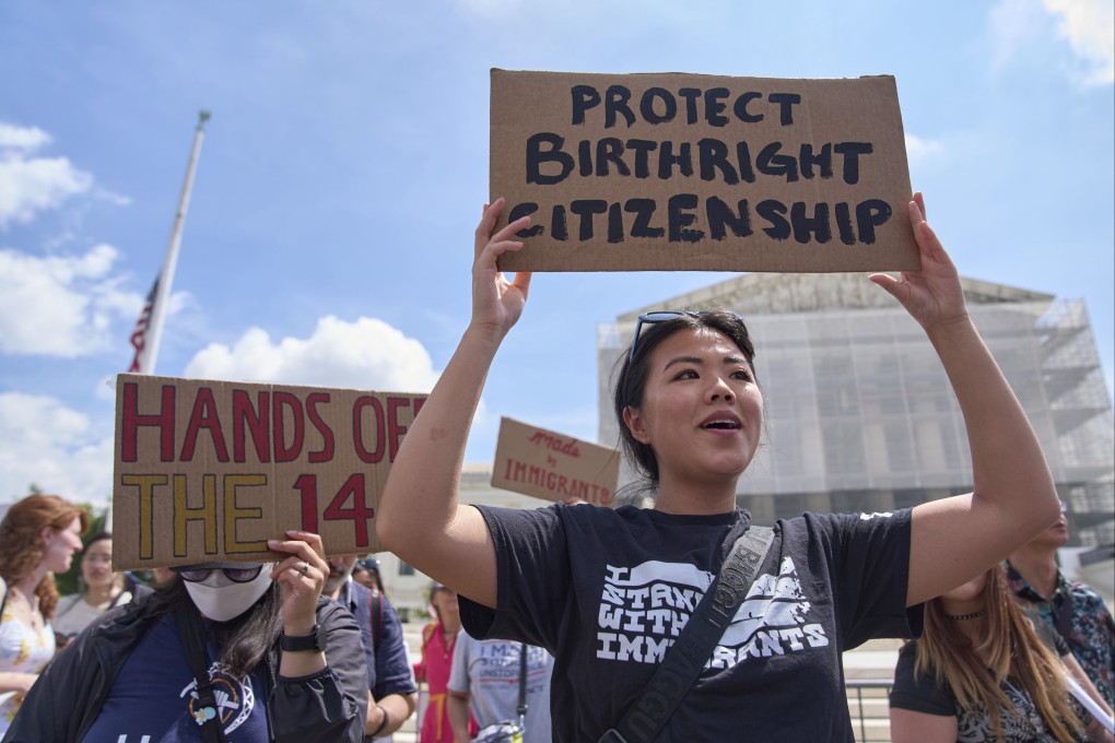 Hannah Liu of Washington, whose parents are Chinese immigrants, holds up a sign in support of birthright citizenship outside the US Supreme Court in May. Photo: AP