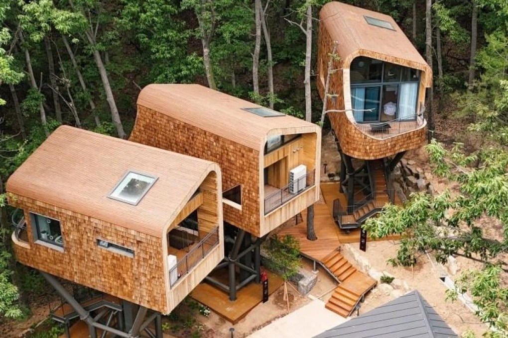 The three tree houses at Surak Hyu in Seoul, South Korea, are each perched on a steel frame 12 to 14 metres above the ground, giving the impression of floating among the trees. Photo: Instagram/paragonstar_