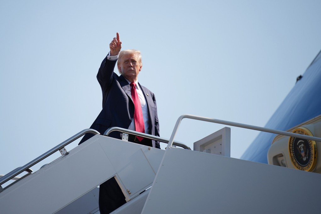 US President Donald Trump boards Air Force One at Joint Base Andrews, Maryland, on Friday before leaving for Scotland. Photo: TNS