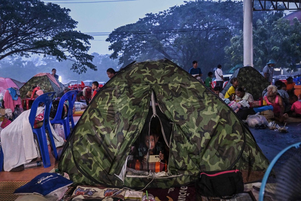 Evacuees displaced by the ongoing conflict between Thailand and Cambodia rest at an evacuation centre in the Thai border province of Sisaket on Saturday. Photo: AFP