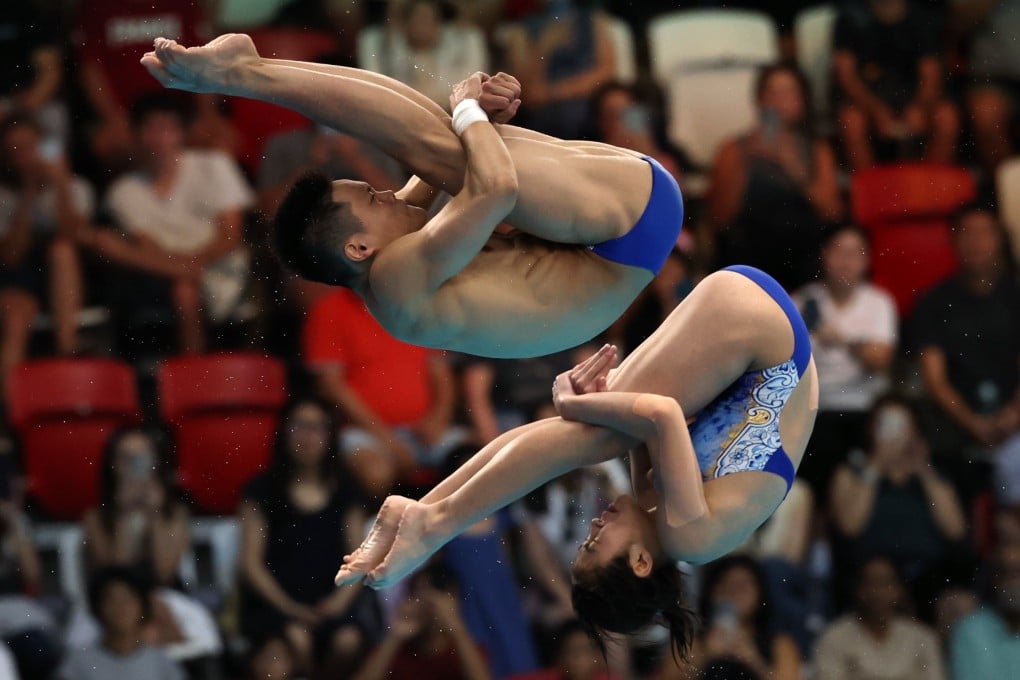 Zhu Yongxin (top) and Xie Peiling compete during the final of the mixed 10M synchronized event at the World Aquatics Championships. Photo: EPA