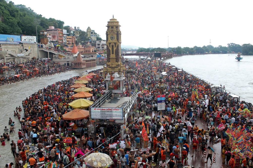 Kanwariyas, devotees of Hindu god Shiva, gather to collect holy water from the river Ganges for the ‘Kanwar Yatra’ pilgrimage during the sacred month of Sawan, at the Har Ki Pauri Ghat in Haridwar on July 16. Photo: AFP
