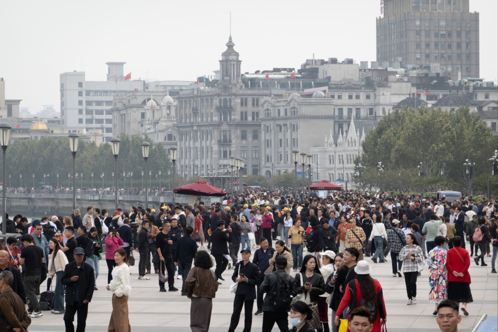 Tourists gather at a waterfront in Shanghai in October 2024. Photo: Getty Images