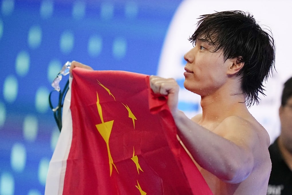 Qin Haiyang of China celebrates after winning the 100m breaststroke at the World Aquatics Championships in Singapore on Monday. Photo: Xinhua