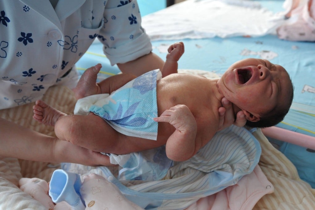 A nurse takes care of a newborn baby at a hospital in Fuyang, in China’s eastern Anhui province on January 17, 2023. Photo: AFP