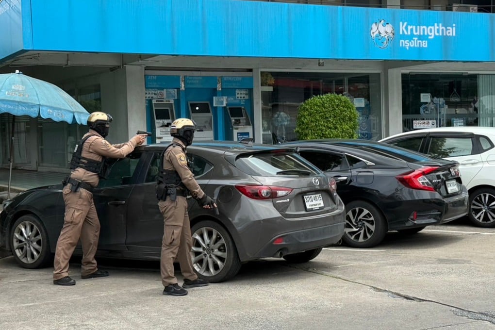 Armed police respond to a mass shooting at a popular market in Thailand’s capital on Monday. Photo: Handout