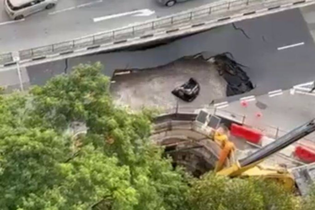 A still from a social media video shows a submerged car after it fell into a sinkhole in Singapore on Saturday. Photo: X/HaggerDarren