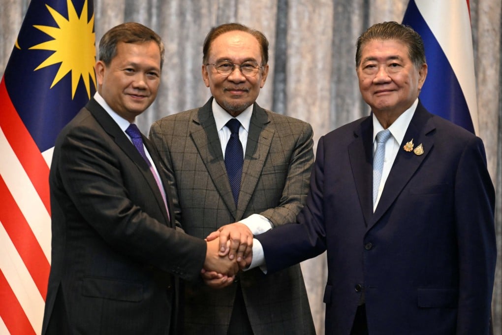 (From left) Cambodia’s Prime Minister Hun Manet, Malaysia’s Prime Minister Anwar Ibrahim and Thailand’s acting prime minister Phumtham Wechayachai shake hands following a press conference, on the day of mediation talks on the Thailand–Cambodia border conflict, in Putrajaya, Malaysia, on Monday. Photo: Reuters