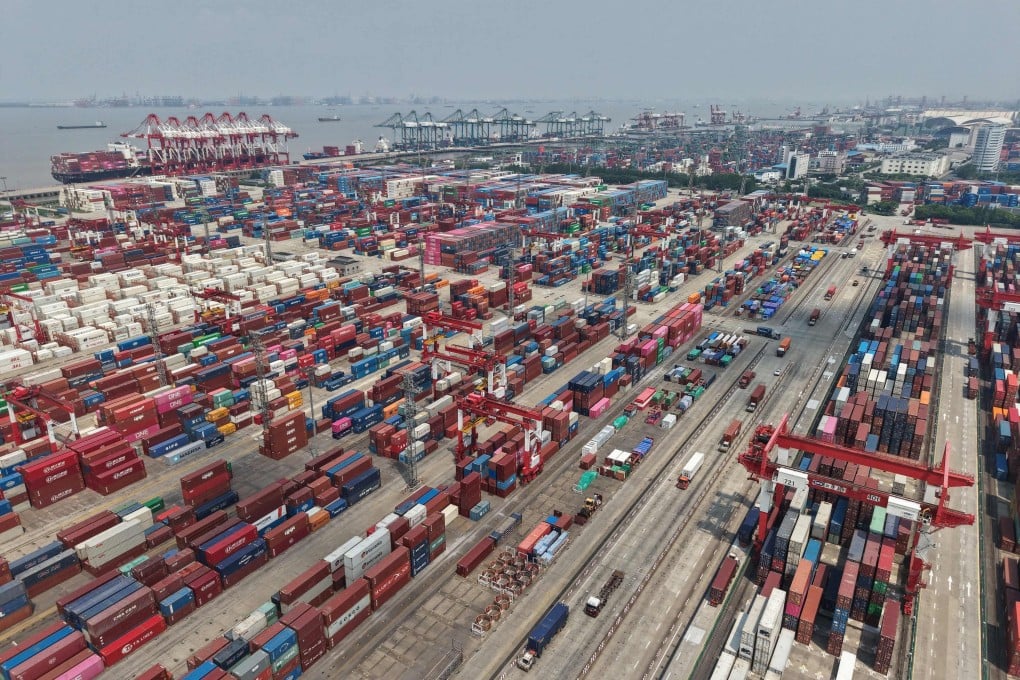 Shipping containers are stacked at a port in Shanghai on June 9. Photo: AFP