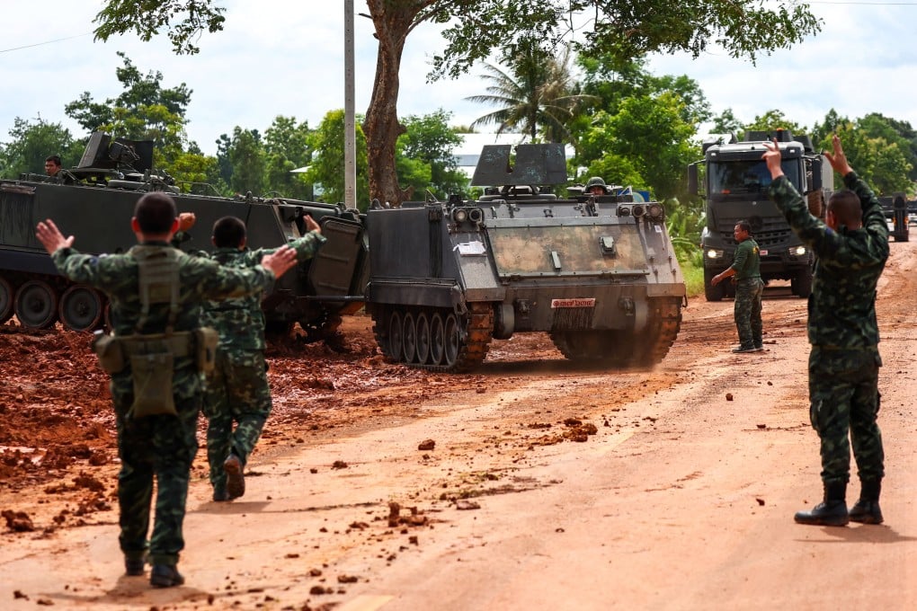 Armoured personnel carriers are seen on a road near the Cambodia border in Thailand’s Sisaket province on Tuesday, a day after the ceasefire was agreed. Photo: Reuters