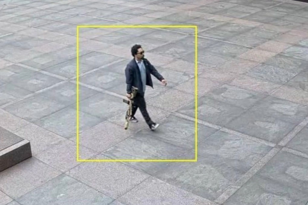 This security camera screenshot shows a man believed to be Shane Tamura, the alleged gunman in the Manhattan shooting incident. Image: NYPD handout