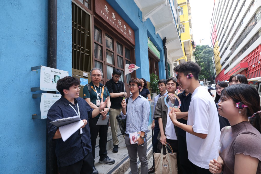 A tour guide leads a group around historic sites in Wan Chai. Photo: Handout