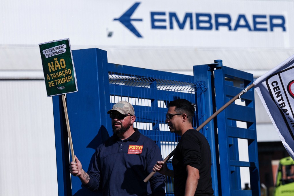 Demonstrators outside the Embraer headquarters and aircraft factory in Sao Jose dos Campos on July 16 protesting the tariffs US President Donald Trump has threatened to impose on Brazilian imports. Photo: Reuters
