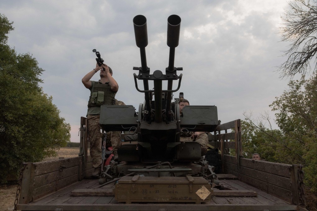 A Ukrainian serviceman of the 59th brigade mobile air defence unit monitors the sky from a military truck this month. Photo: AFP