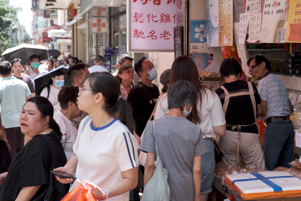 Crowds gather outside a bakery in Sham Shui Po to buy mooncakes and other baked goods on September 11. Photo: Connor Mycroft