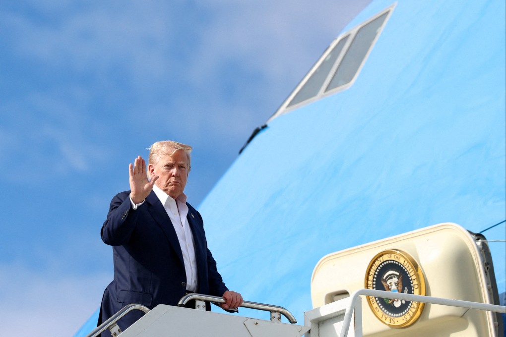 US President Donald Trump waves while boarding Air Force One as he prepares to return to Washington from Lossiemouth, Scotland, UK on Tuesday. Photo: Reuters