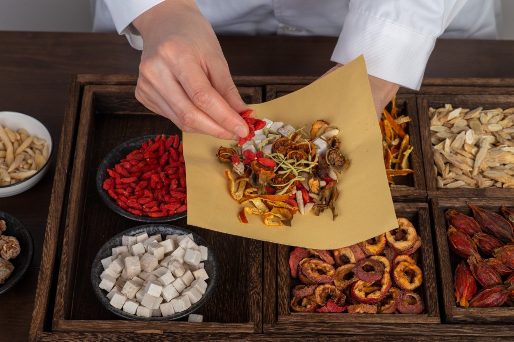 A TCM practitioner prepares traditional Chinese medicine ingredients. Discover how TCM aided a Hong Kong student’s weight loss journey and learn expert tips. Photo: Shutterstock